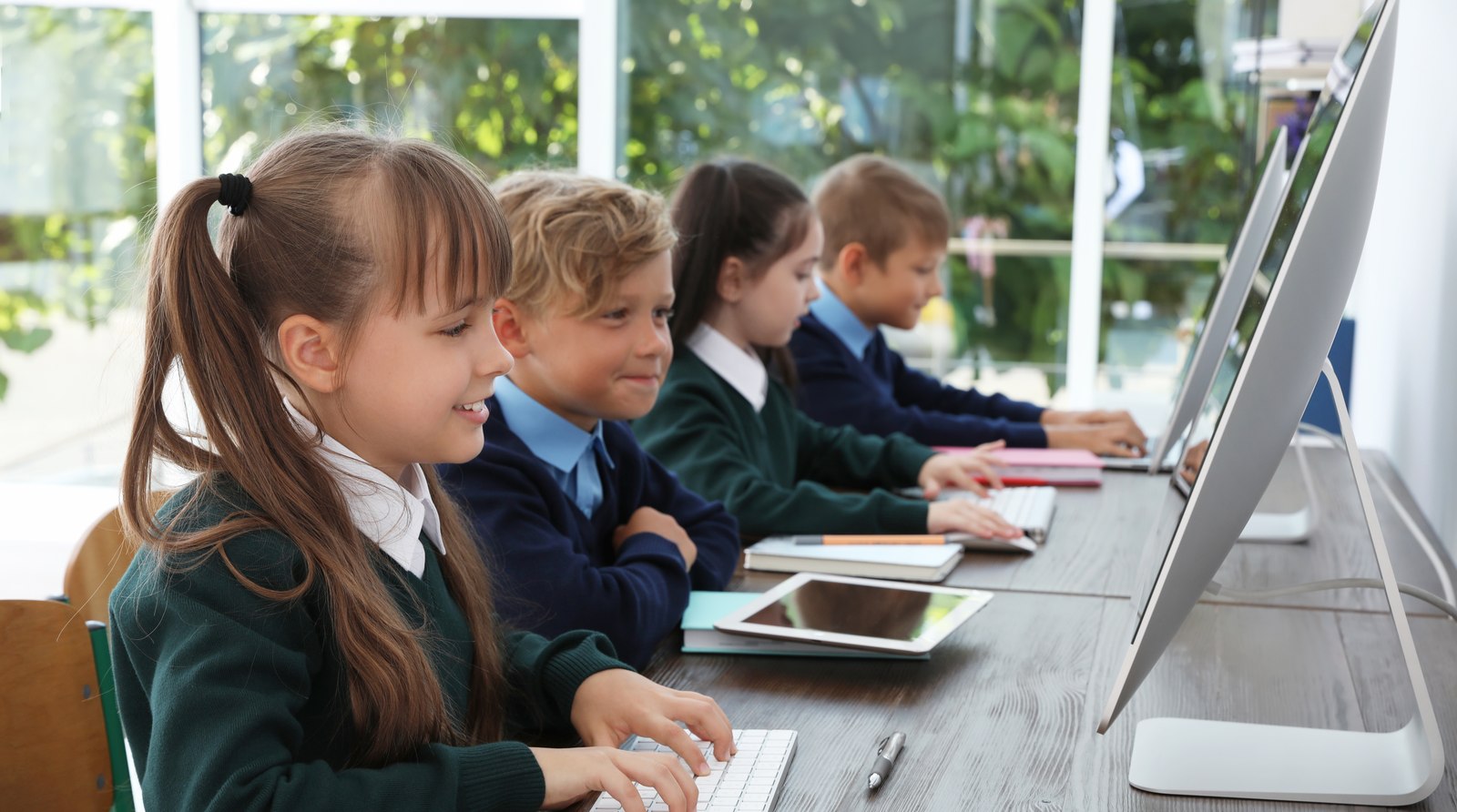 Children working at classroom computers — EHCP but no school place in Kent, rights explained